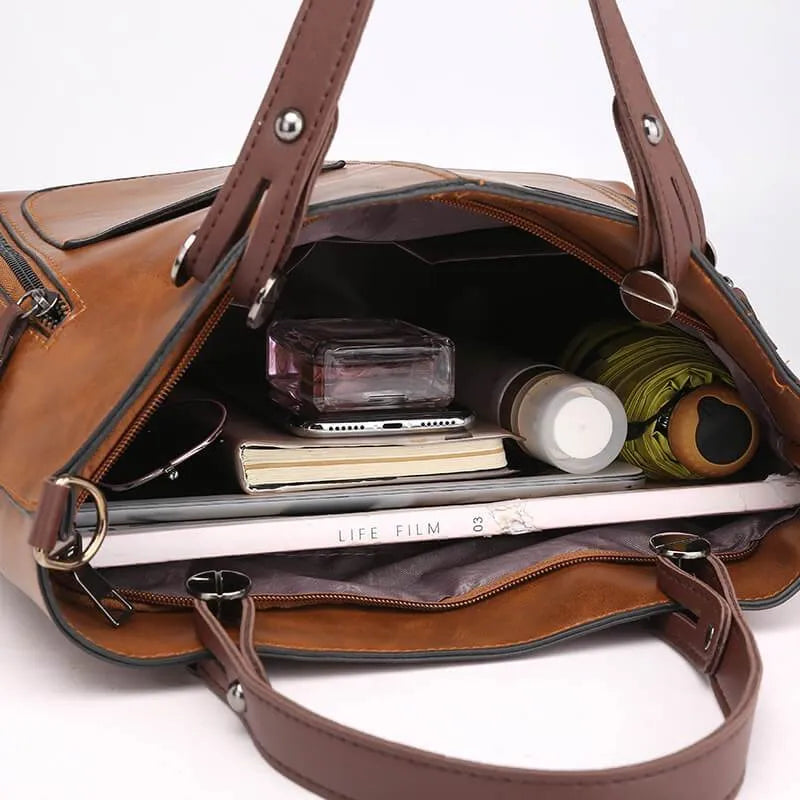 Håndveske med avtakbar stropp for dame – i skinnlook med fôr i mikrosemsket